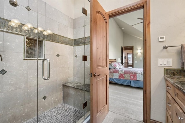 17 James Ct, Dillon, CO 80435 - full bath with ensuite bath, vanity, a stall shower, vaulted ceiling, and tile patterned flooring