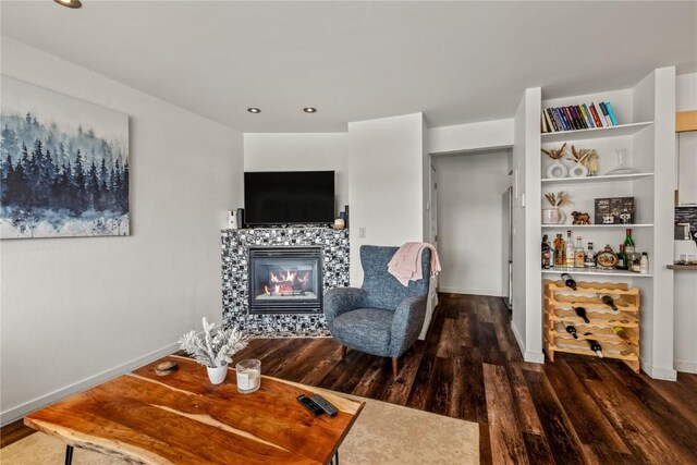 21 Cypress Ct, Steamboat Springs, CO 80487 - living area featuring wood finished floors, a tiled fireplace, baseboards, and recessed lighting