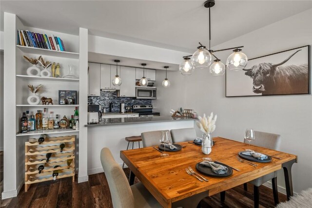 21 Cypress Ct, Steamboat Springs, CO 80487 - dining space with wood finished floors and a bar