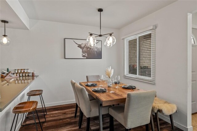 21 Cypress Ct, Steamboat Springs, CO 80487 - dining room featuring baseboards and wood finished floors