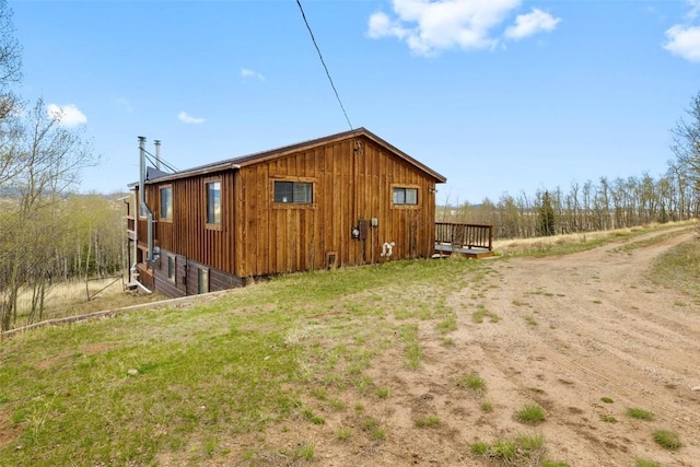 2349 Michigan Hill Rd, Jefferson, CO 80456 - view of side of property with a deck and board and batten siding