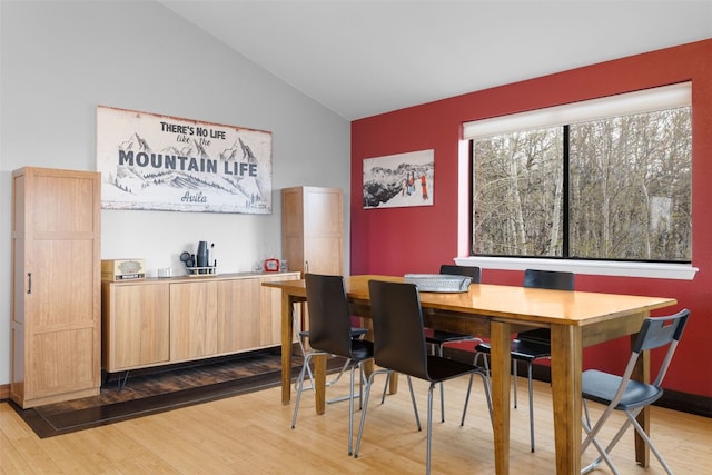 2349 Michigan Hill Rd, Jefferson, CO 80456 - dining space with wood finished floors and high vaulted ceiling