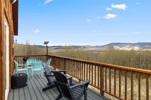 2349 Michigan Hill Rd, Jefferson, CO 80456 - wooden deck with a mountain view and outdoor dining space