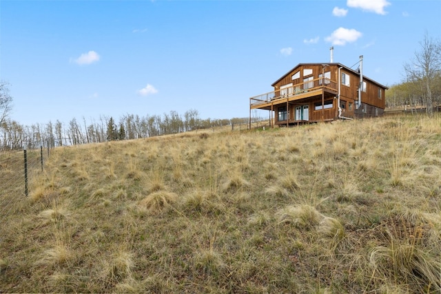 2349 Michigan Hill Rd, Jefferson, CO 80456 - rear view of property featuring a wooden deck and a view of rural / pastoral area