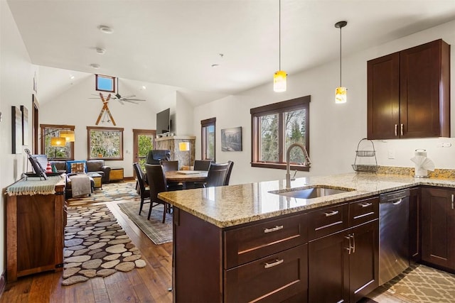 830 Blue River Pkwy Unit 203, Silverthorne, CO 80498 - kitchen with dishwasher, a sink, a peninsula, hardwood / wood-style floors, and light stone countertops