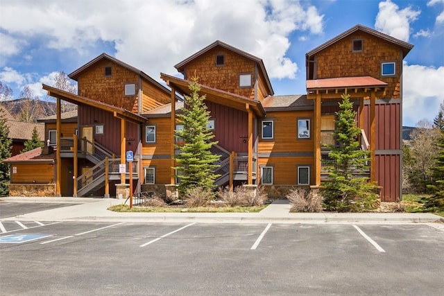 830 Blue River Pkwy Unit 203, Silverthorne, CO 80498 - view of building exterior with stairway and uncovered parking