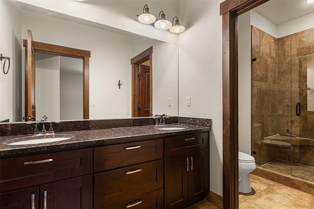 830 Blue River Pkwy Unit 203, Silverthorne, CO 80498 - bathroom featuring toilet, a stall shower, and double vanity