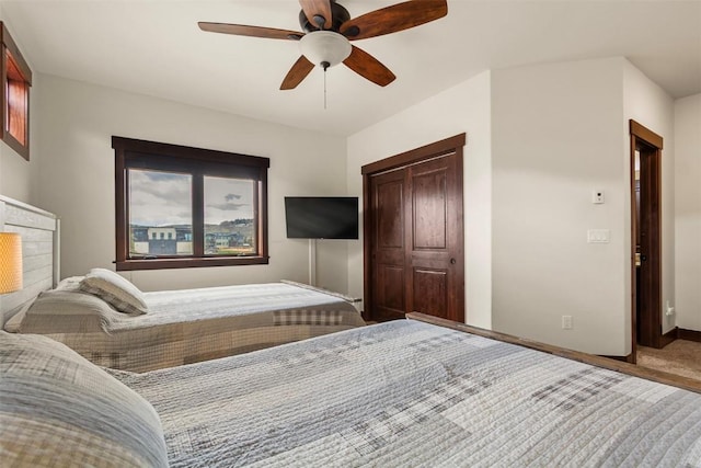 830 Blue River Pkwy Unit 203, Silverthorne, CO 80498 - carpeted bedroom with baseboards and a ceiling fan