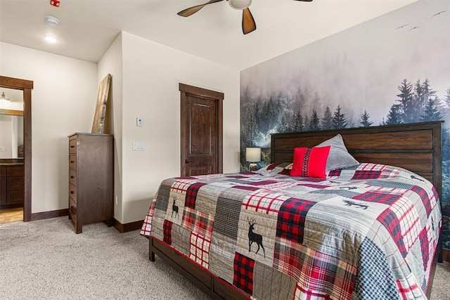 830 Blue River Pkwy Unit 203, Silverthorne, CO 80498 - carpeted bedroom featuring baseboards, a ceiling fan, and connected bathroom