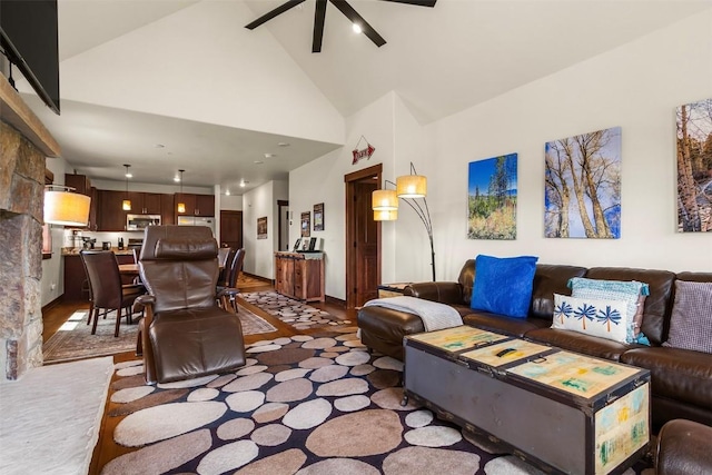830 Blue River Pkwy Unit 203, Silverthorne, CO 80498 - living area featuring ceiling fan, high vaulted ceiling, and wood finished floors