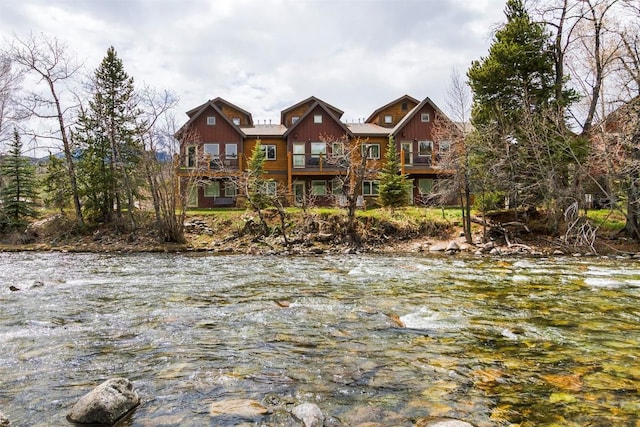 830 Blue River Pkwy Unit 203, Silverthorne, CO 80498 - view of front facade with a balcony and a water view