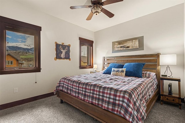 830 Blue River Pkwy Unit 203, Silverthorne, CO 80498 - carpeted bedroom featuring baseboards and ceiling fan