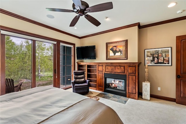 1115 Steamboat Blvd, Steamboat Springs, CO 80487 - bedroom with a glass covered fireplace, light carpet, baseboards, ornamental molding, and a ceiling fan