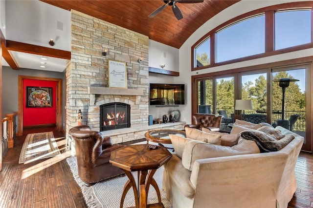 1115 Steamboat Blvd, Steamboat Springs, CO 80487 - living area featuring hardwood / wood-style floors, a ceiling fan, a stone fireplace, high vaulted ceiling, and wood ceiling