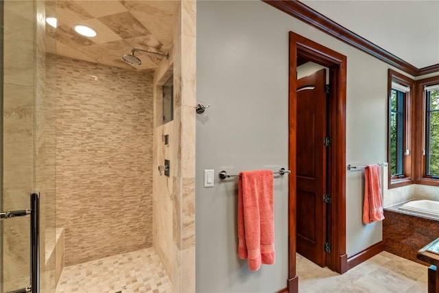 1115 Steamboat Blvd, Steamboat Springs, CO 80487 - bathroom featuring ornamental molding, a stall shower, and a garden tub