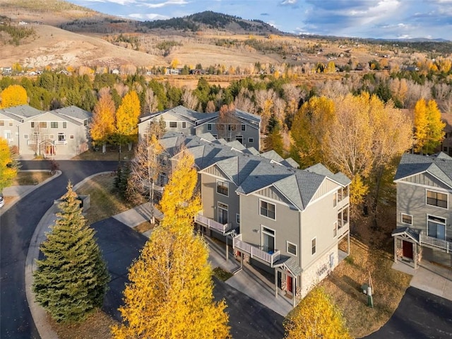 birds eye view of property with a mountain view and a residential view