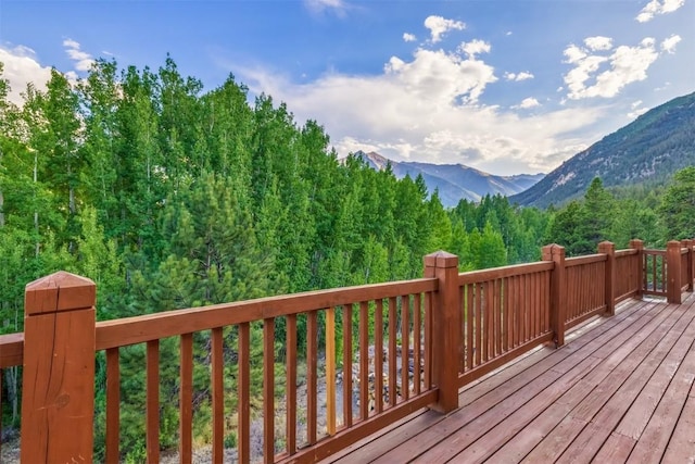 wooden deck with a mountain view