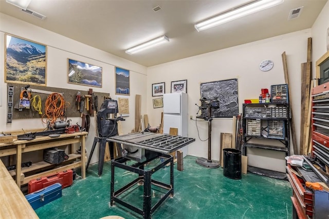 office area featuring a workshop area and dark carpet