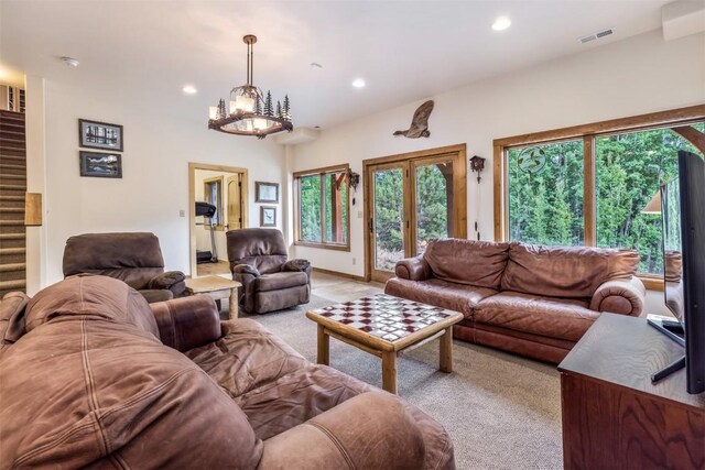 living room featuring an inviting chandelier