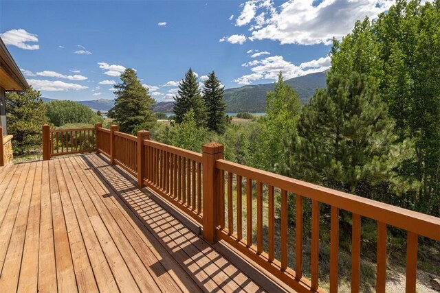 wooden deck featuring a mountain view