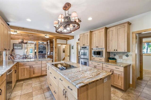 kitchen featuring a center island, an inviting chandelier, beamed ceiling, kitchen peninsula, and appliances with stainless steel finishes