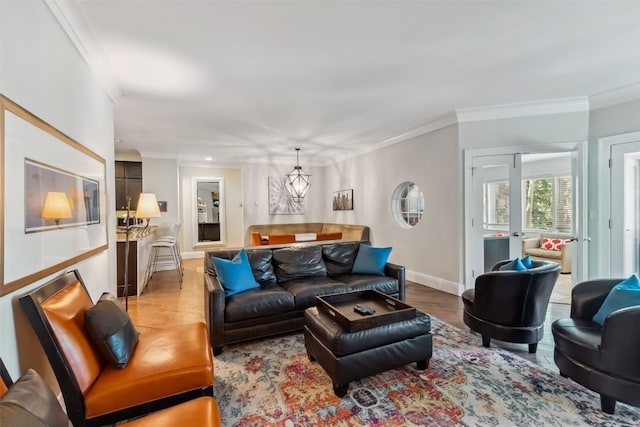 1207 W Keystone Rd Unit 2701, Keystone, CO 80435 - living area featuring crown molding, light wood-type flooring, and a chandelier
