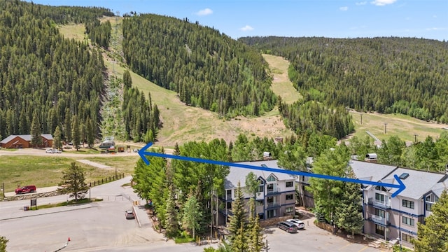 1207 W Keystone Rd Unit 2701, Keystone, CO 80435 - aerial view of a forest and a mountain backdrop