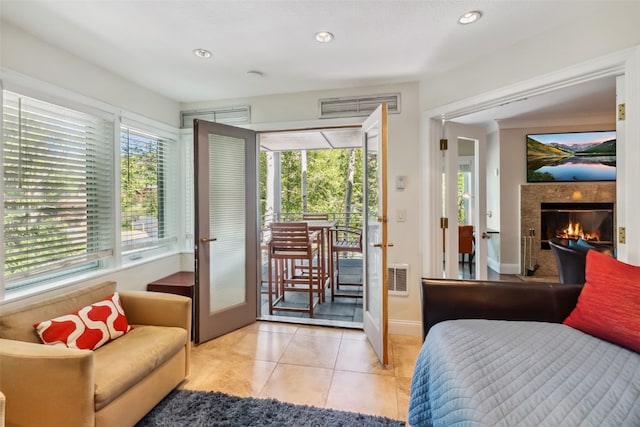 1207 W Keystone Rd Unit 2701, Keystone, CO 80435 - bedroom featuring access to exterior, french doors, recessed lighting, tile patterned flooring, and a tiled fireplace