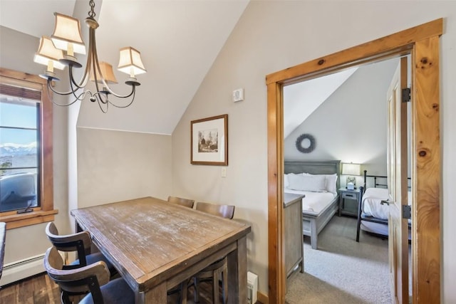 carpeted dining space featuring a chandelier and lofted ceiling
