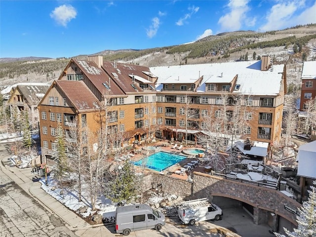 snow covered pool with a mountain view