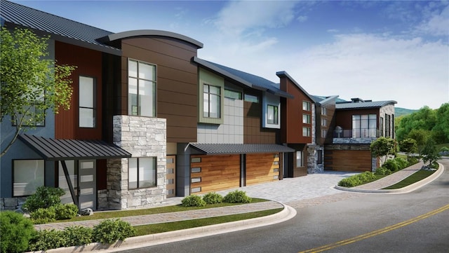 1855 Burgess Creek Rd Unit 3 & 4, Steamboat Springs, CO 80487 - modern home featuring stone siding, a standing seam roof, metal roof, and a garage