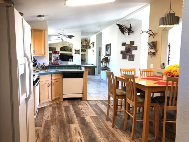 1983 Arapahoe Rd, Hartsel, CO 80449 - kitchen featuring dark wood finished floors, a sink, white appliances, a peninsula, and ceiling fan