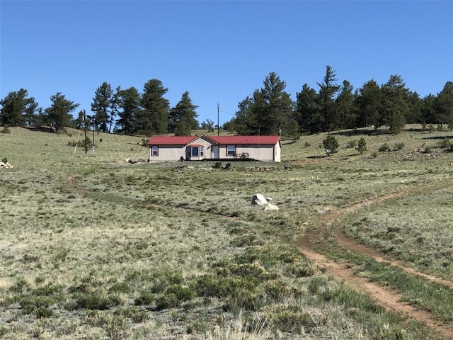 view of yard with a rural view