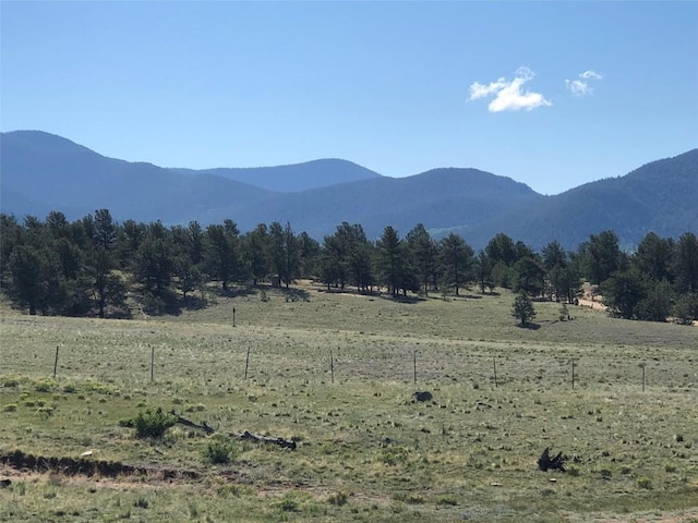 view of mountain feature with a rural view