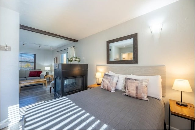 bedroom with wood finished floors
