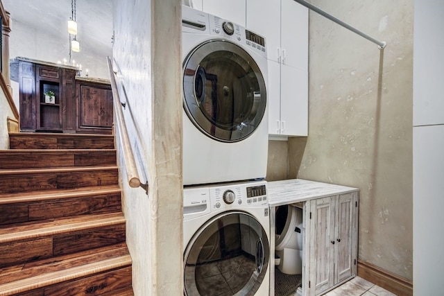 432 Bighorn Cir, Silverthorne, CO 80498 - laundry room with estacked washer and dryer and cabinet space