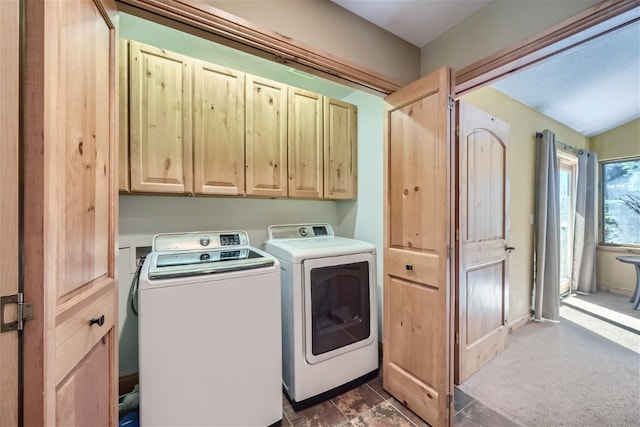laundry room with cabinet space and washer and clothes dryer