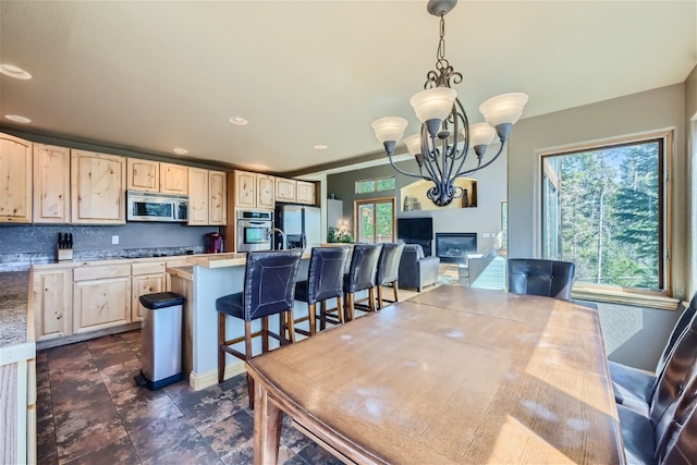 dining room with an inviting chandelier and recessed lighting