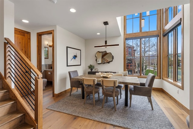 317 Granite St Unit 5, Frisco, CO 80443 - dining room featuring baseboards, stairs, healthy amount of natural light, recessed lighting, and light wood-style floors