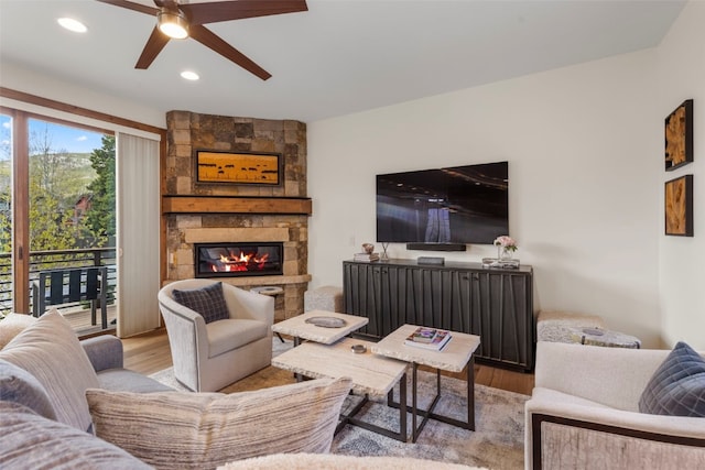 317 Granite St Unit 5, Frisco, CO 80443 - living area with wood finished floors, a ceiling fan, a fireplace, and recessed lighting