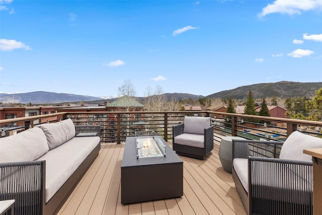 317 Granite St Unit 5, Frisco, CO 80443 - deck featuring an outdoor living space with a fire pit and a mountain view