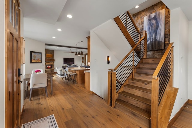 317 Granite St Unit 5, Frisco, CO 80443 - stairs featuring hardwood / wood-style floors, recessed lighting, baseboards, and a fireplace