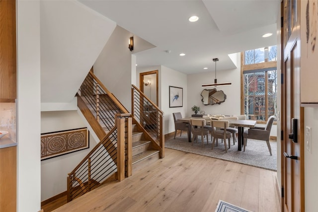 317 Granite St Unit 5, Frisco, CO 80443 - dining area featuring light wood-style flooring, recessed lighting, baseboards, and stairway