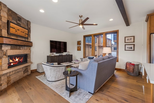 317 Granite St Unit 5, Frisco, CO 80443 - living room featuring ceiling fan, a stone fireplace, hardwood / wood-style floors, baseboards, and recessed lighting