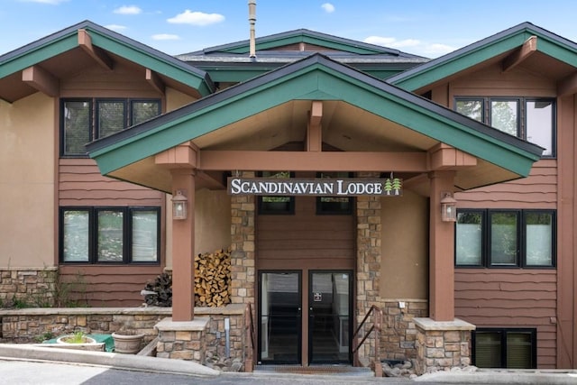 2883 Burgess Creek Rd Unit 203, Steamboat Springs, CO 80487 - doorway to property with stone siding