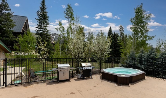 2883 Burgess Creek Rd Unit 203, Steamboat Springs, CO 80487 - view of patio / terrace with a grill and a hot tub
