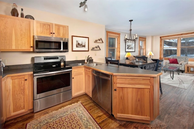 100 Dercum Sq Unit 8342, Keystone, CO 80435 - kitchen featuring stainless steel appliances, an inviting chandelier, a sink, a peninsula, and open floor plan