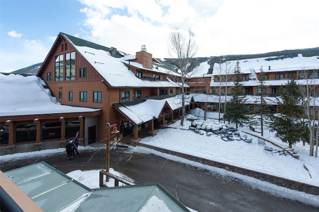 100 Dercum Sq Unit 8342, Keystone, CO 80435 - snow covered rear of property featuring board and batten siding