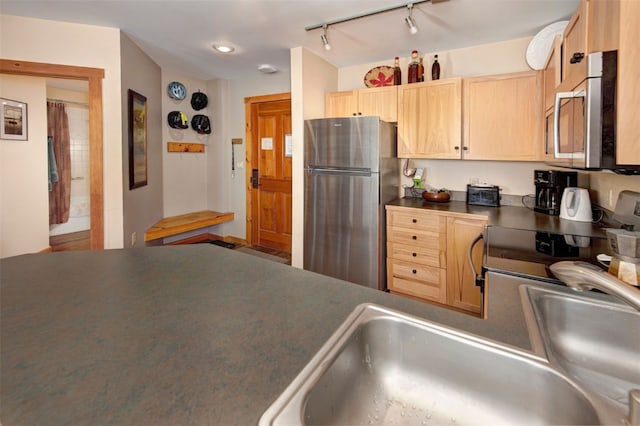 100 Dercum Sq Unit 8342, Keystone, CO 80435 - kitchen featuring dark countertops, light brown cabinets, a sink, and appliances with stainless steel finishes