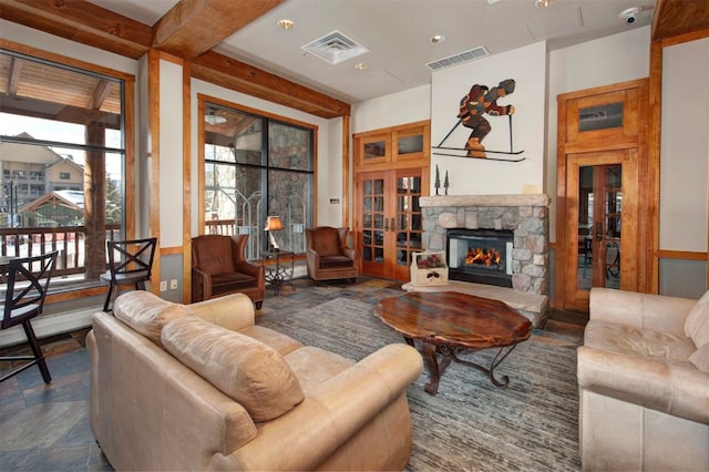 100 Dercum Sq Unit 8342, Keystone, CO 80435 - living area featuring french doors, a stone fireplace, and visible vents